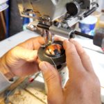 Couture du sertissage du bouton